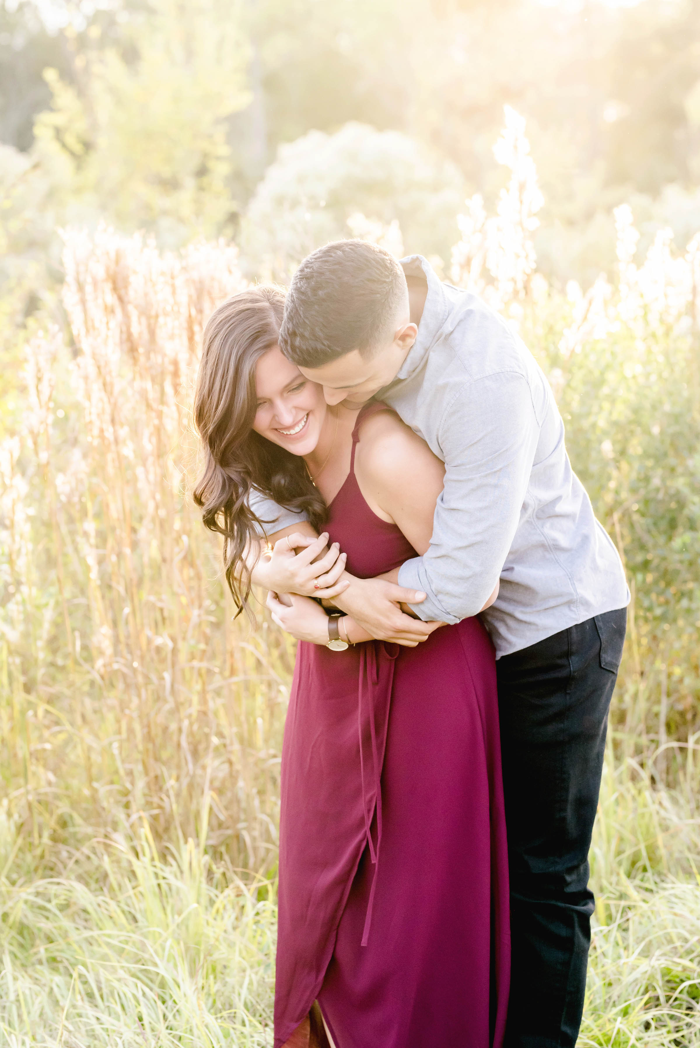 man hugging girl with the sun shining