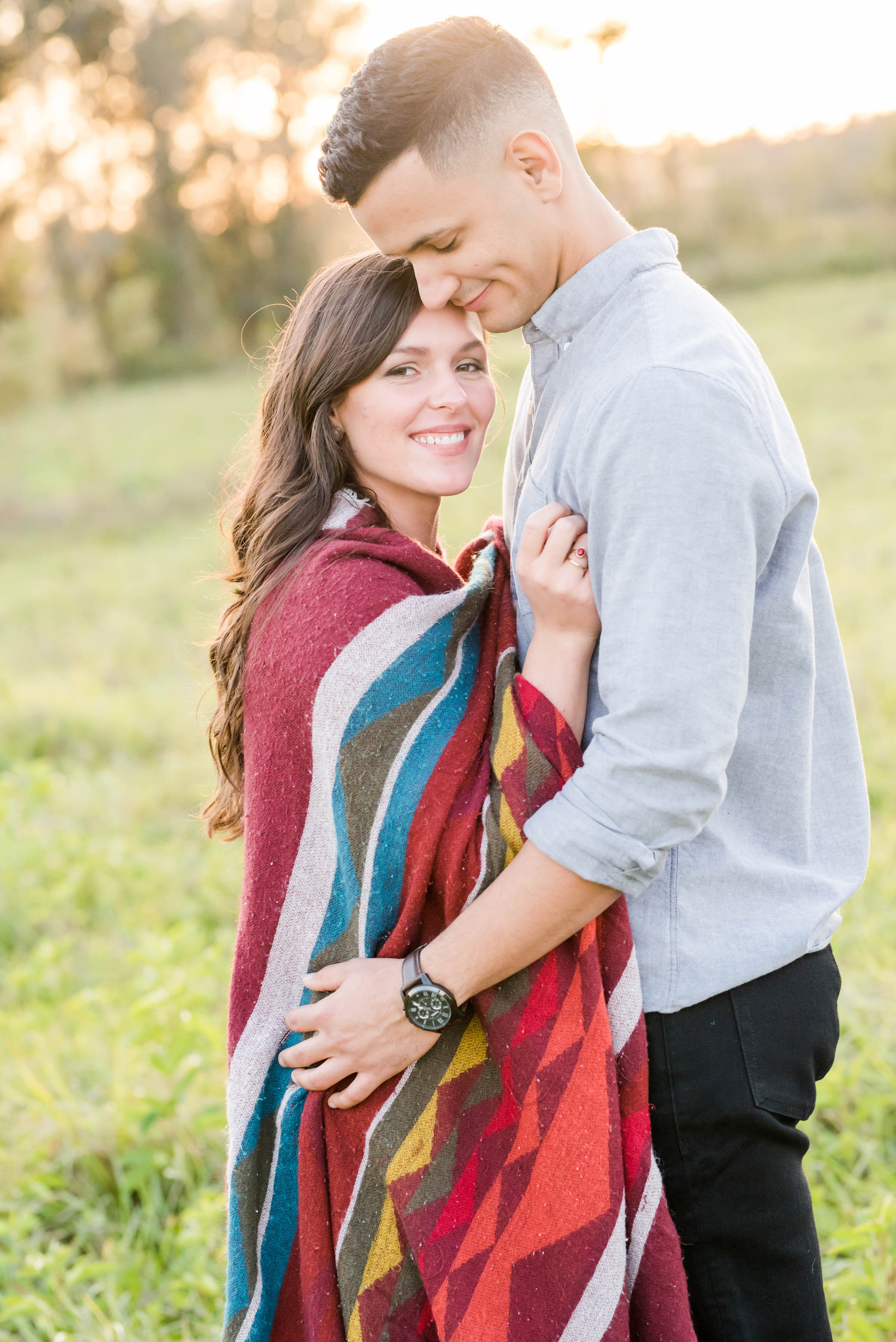 boho engagement session couple in a field